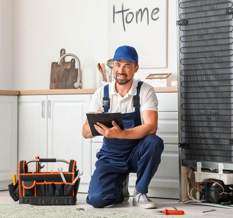 handyman making notes in home